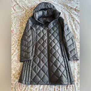 Gray Michale Kors packable down jacket. Hits mid thigh.